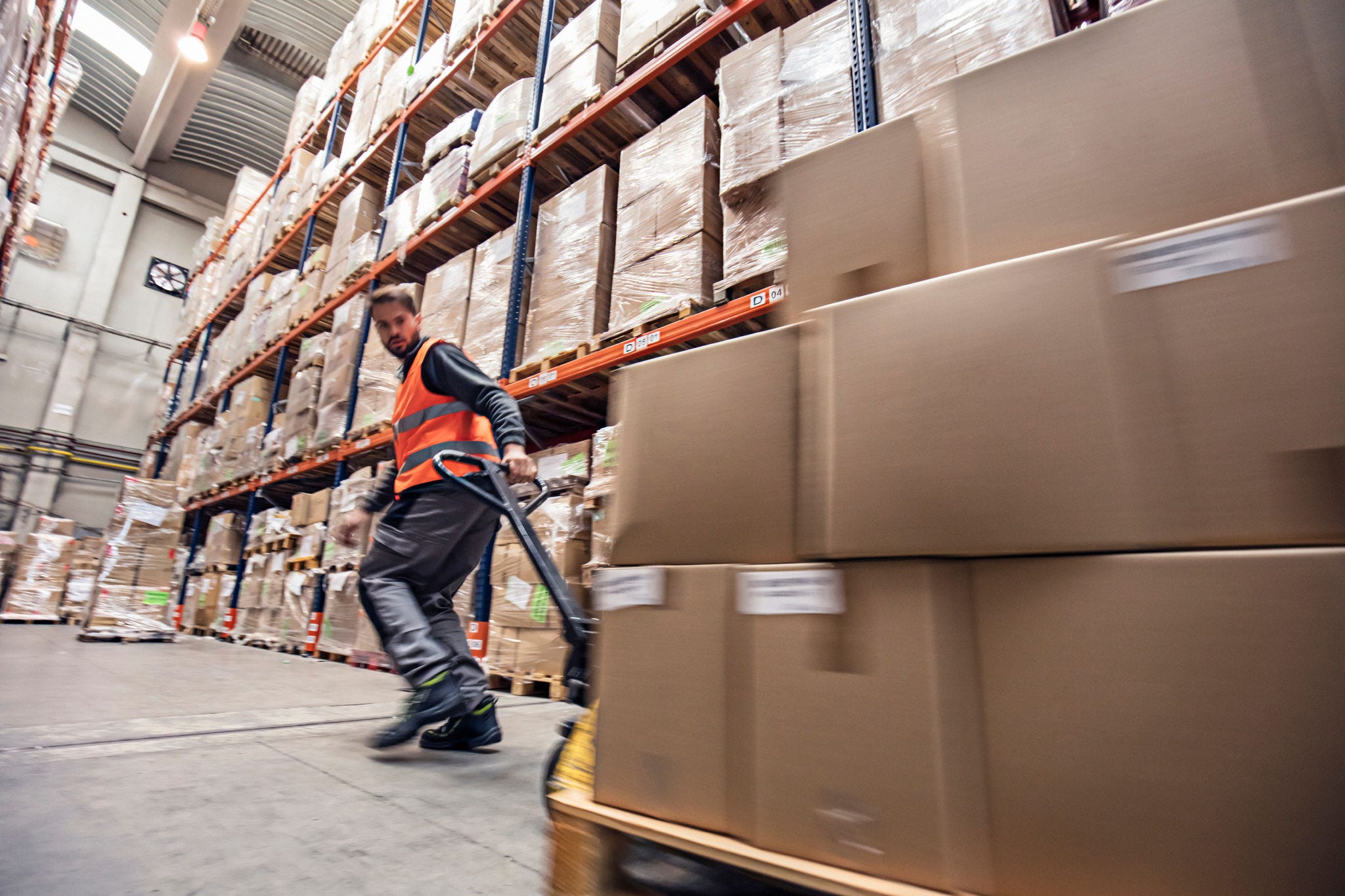 a man in a warehouse with boxes